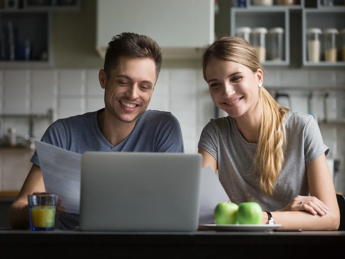 Couple looking at the computer for mortgages